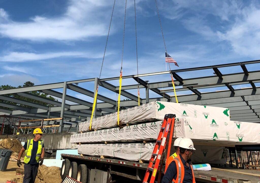 Crane lifting lumber